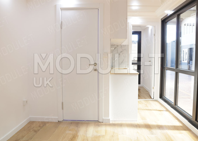 Completed modular container unit with door and windows