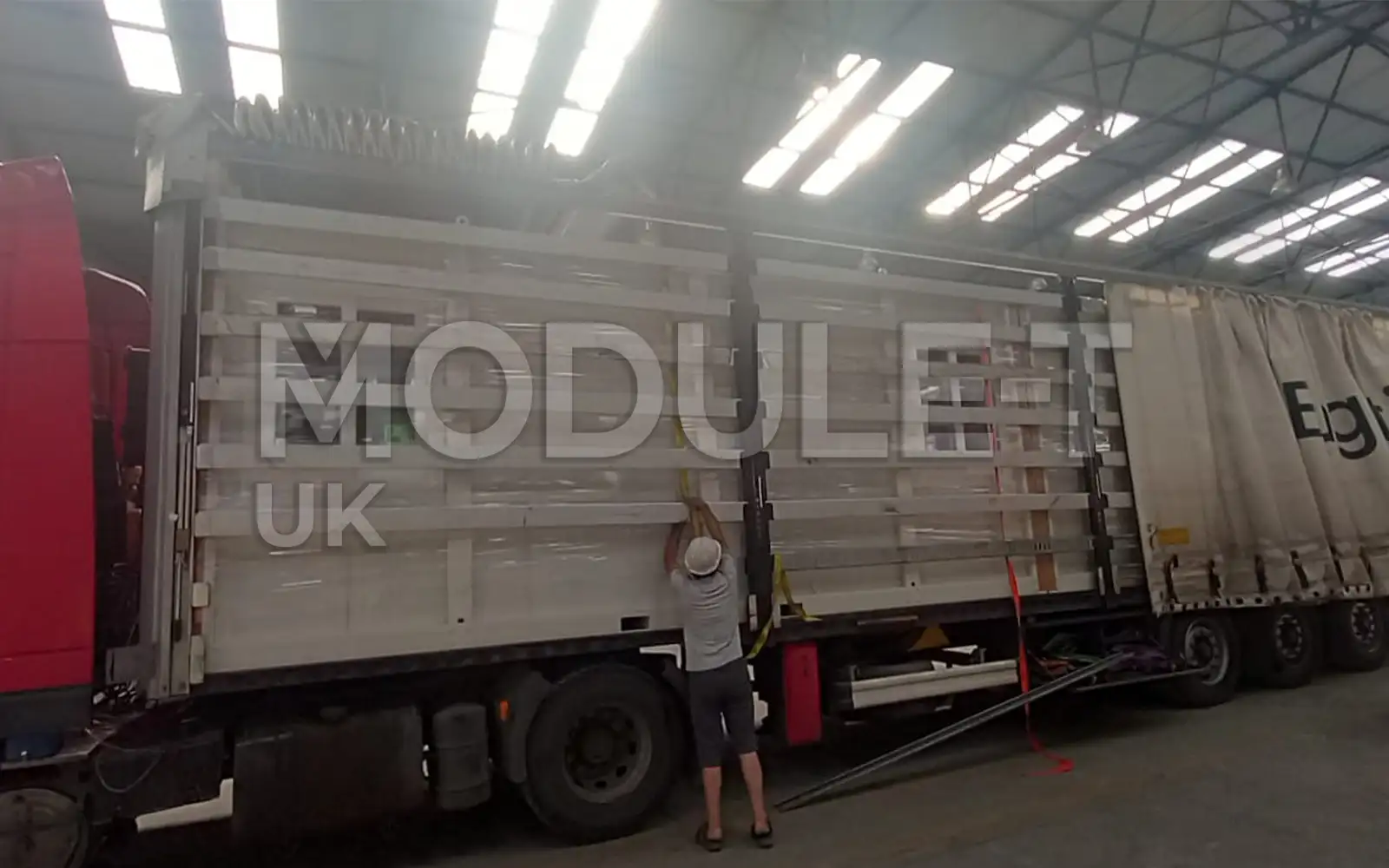 Office container loaded onto truck — Module-T UK
