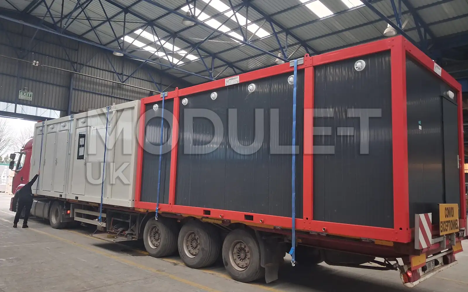 Red and grey office containers on trailer — Module-T UK