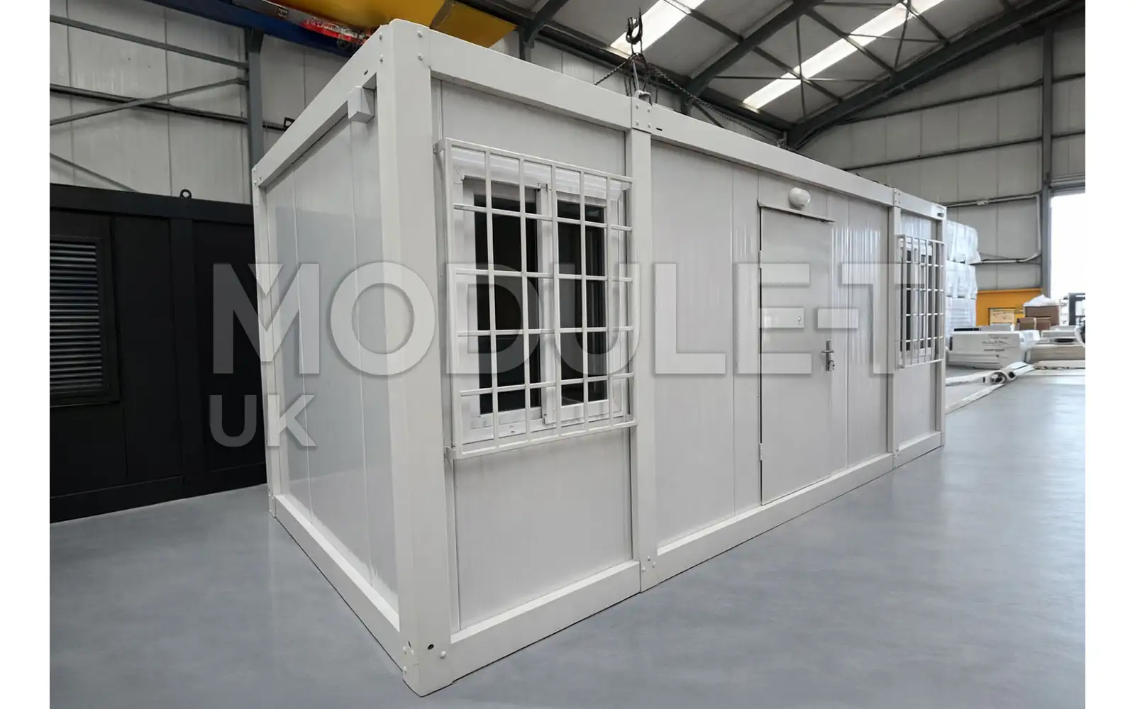 Site office cabin exterior with window bars — Module-T UK